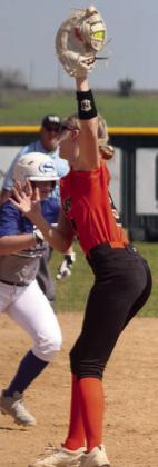 First baseman Olivia Mathis snags an infield popup in the Lady Horns’ first game on Saturday. Sticker Photo By Darrell Vyvjala