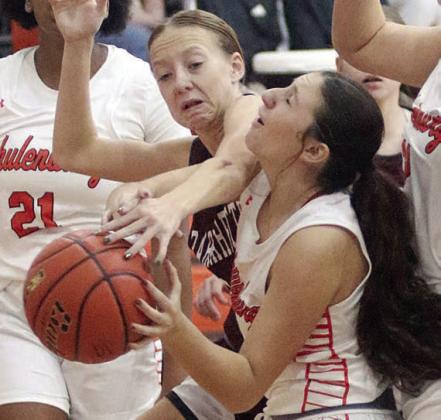 Jordin Davis gets fouled on her way up for a shot to earn a trip to the freethrow line against East Bernard. Sticker Photo By Darrell Vyvjala