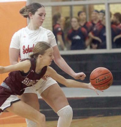 Grace Schramek cuts off an East Bernard ball-handler to force a turnover during Thursday’s game. Sticker Photo By Darrell Vyvjala