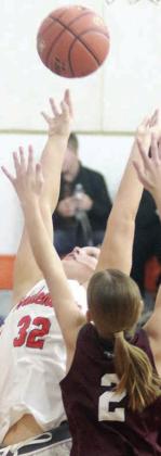 Ava Bubela scores over a Brahmarette in the second half on Dec. 4. Sticker Photo By Darrell Vyvjala