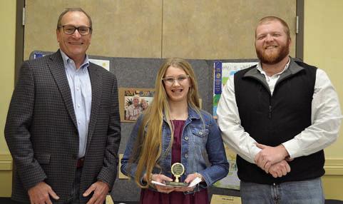 POSTER CONTEST winners in Divisio n 2 (grades 3-6) were Kirtley Kallus (center) of Sacred Heart School in La Grange and Tripp Brown (not shown) of St. Rose of Lima Catholic School in Schulenburg. Presenters were Tim Knesek (left) of Capital Farm Credit and Ty Dallmeyer (right) of Fayetteville Bank.