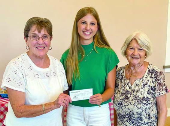 The Amos Pavlik Memorial Sc holarship was presented to Clara Magliolo (center) by Fayette County Czech Heritage Society chapter President Betty Danner (right) and Carolyn Heinsohn (left).