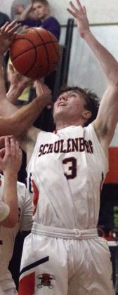 Nick Goode battles for a rebound in the second half last Tuesday. Sticker Photo By Darrell Vyvjala