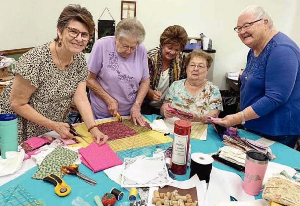 QUILT PROJECT – Some of the ladies consulting on a quilt project for Navidad Valley Community Connections include (from left) Debbie Flous, Irene Janda, Nancy Hay, Kathy Bertsch and Betty Gabler. Plans call for the quilt to be auctioned closer to Christmas.