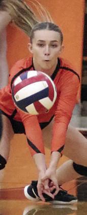 Jenna Guentert makes a diving dig in the first set last Tuesday. Sticker Photo By Darrell Vyvjala