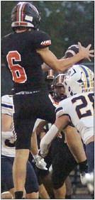 Zane Brenek makes a leaping reception for 7 yards in the first quarter. Sticker Photo By Darrell Vyvjala