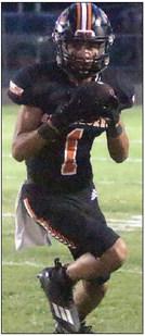 Jose Cortez turns upfield after a catch in the first quarter for 6 yards. Sticker Photo By Darrell Vyvjala