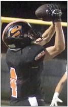 Nick Goode snags a pass in the third quarter for a 16-yard gain. Sticker Photo By Darrell Vyvjala