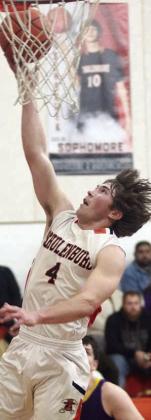 Jayse Janda flies in for a layup in the second quarter against the Wildcats. Sticker Photo By Darrell Vyvjala
