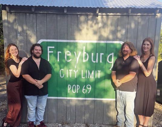 Fayette County Community The atre will host the performance of “Now and Then” at Freyburg Hall. Shown in front of one of the buildings are cast members (from left) Emily Hudson,Austin Williams, Brandon Thuet and Melanie Lira.