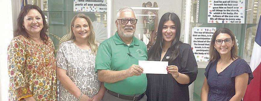 St. Mich ael Cathol ic School Teach er Gr ant Recipients – (from left) Sherry Pietsch, Ann Barlow, Julius Castillo and (right) Kari Tumis. Representing the Stanzel Family Foundation is Melanie Ramirez (second from right), program director.