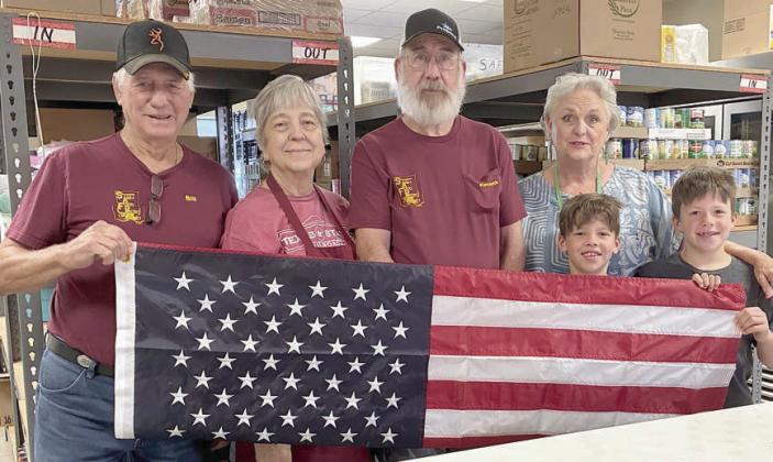Schulenburg Hermann Sons Life Lodge 14 recently donated a U.S. flag to the Schulenburg Area Food Pantry. Shown are (from left) Bill Michalke, Debbie Behlen, Kenneth Behlen and Debra Blansitt with her grandsons Korbin and Ronan Parton – all Hermann Sons Life members.
