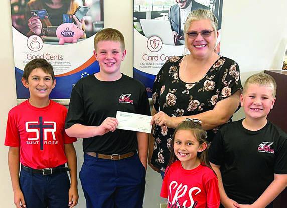 Representing Prosperity Bank is Missy Thomas (back right), shown with St. Rose students (front row, from left) Emma Zweschper, Brody Brossmann, (back row) Dylan Zweschper and Bo Brossmann.
