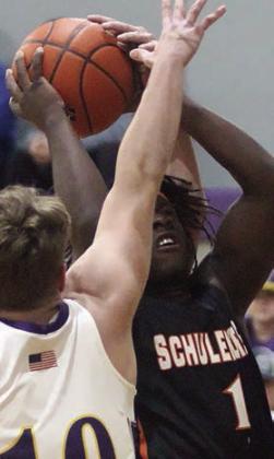 Rodney H Walton draws a foul on a shot in the first quarter against Weimar. Sticker Photo By Darrell Vyvjala