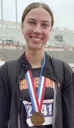 Meredith Magliolo poses after receiving her bronze medal. Sticker Photo By Darrell Vyvjala