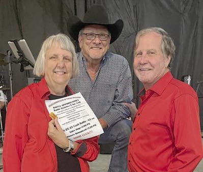 In the drawing, first prize, a $50 Majek Wine Gift Certificate, went to Kenneth Kristynik (center), band leader. Presenters were Jan Koehn (left), PLCTM vice president, and Gary Bucek (right), PLCTM president.