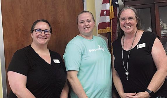 Presenters – Sarah Nickel (left),ACCSS student success coach, and Susie Shank (right), ACCSS director, shown with Kristi McBride (center), Schulenburg Lions Club president,