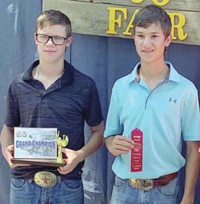 QUIZ WINNERS – In the commercial heifer show Cattleman’s Quiz contest, (from left) Gavin Kubala placed first and Grant Kubala placed second.