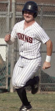to drive in Brycen Schramek digs for home to score from second base. Sticker Photo By Darrell Vyvjala