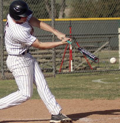 Owen Brenek connects for an RBI-single on Friday. Sticker Photo By Darrell Vyvjala