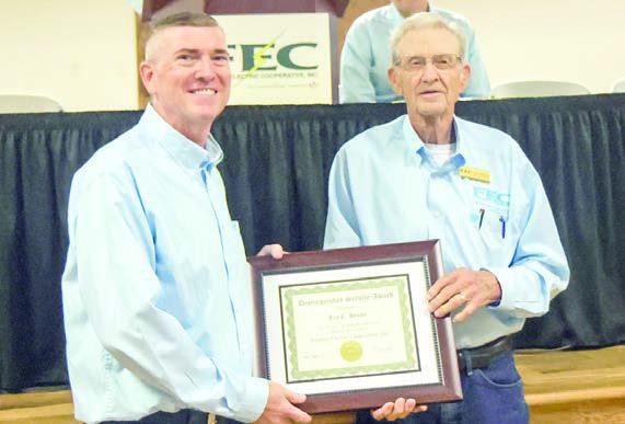 Leo C. Henke (right), District 4 director, retired from the board of directors after serving for 22 years. Henke received a distinguished service award from General Manager/CEO Doug Lambert (left).