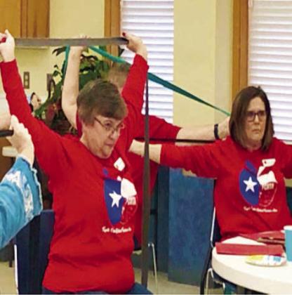 Working on upperarm strength are members Kathy Migl and Debbie Morrill.
