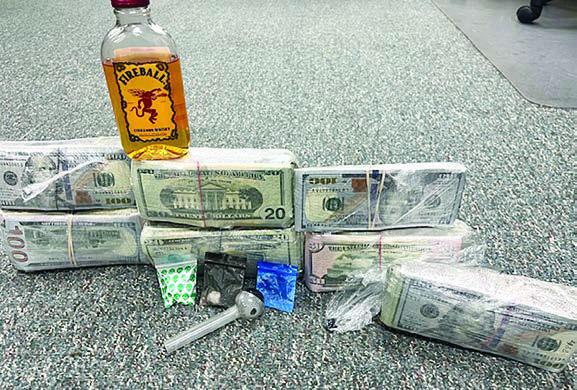 Cash totaling $67,695 along with cocaine, heroin and a meth pipe were confiscated during a traffic stop on I-10 near the Fayette/Gonzales County line.