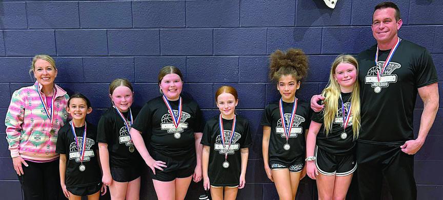 The Schulenburg “Black” team won the 2025 fourth-grade girls’ division playoff tournament recently with an 18-point win over Flatonia in the semifinals and an 11-point victory in the championship game. Shown above are: (from left) coach Kacy McBride, Emma Zweschper, Abigale McBride, Emma McCourt, Rowan Heinrich, Haven Sheppard, Adelyn Hollas, and coach Shannon Hollas.