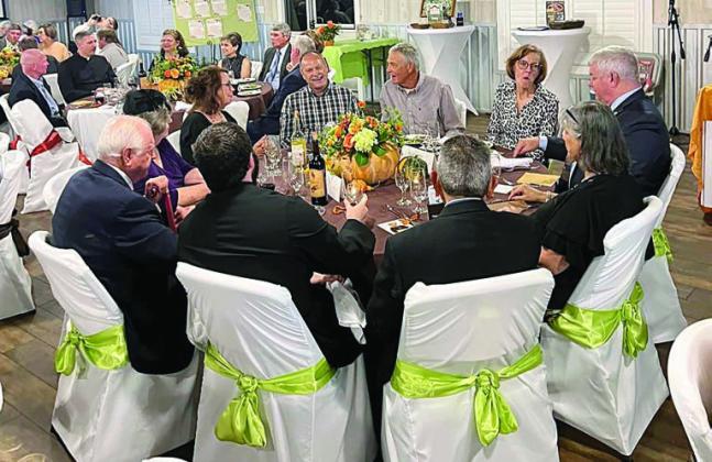 Guests at the St. Michael and St. Rose of Lima parish tables enjoyed a night of fellowship and mission, all benefitting God’s Embrace Ministries.