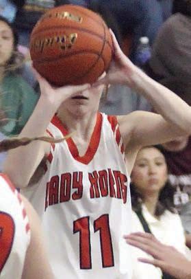 Alana Herzik lines up a trey in the second quarter against Flatonia. Sticker Photo By Darrell Vyvjala