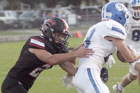 John Davis chases down Andrew Steffek for no gain on the Indians’ first play from scrimmage. Sticker Photo By Layne Vyvjala