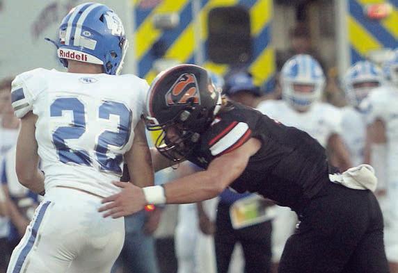 Jayse Janda tackles Wyatt Matura for a loss of 3 early in the game. Sticker Photo By Layne Vyvjala