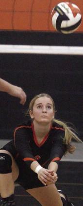 Madison Kunschick picks up a Lady Cardinal attack in game one on Sept. 10. Sticker Photo By Darrell Vyvjala