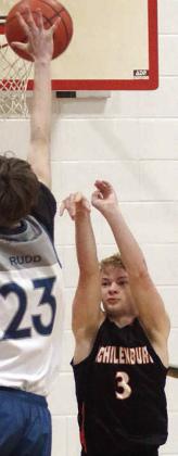 Caden Herzik launches a threepointer in the first quarter Friday morning. Sticker Photo By Darrell Vyvjala