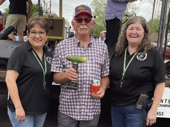 PICKLES - 1ST PLACE: Marcus Demel (center) and his wife, Maggie (not shown). Also pictured are Sausagefest Committee members Liz Garcia Vaughan (left) and Debbie Preece. Sticker Photo By Darrell Vyvjala