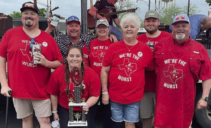 PEOPLES’ CHOICE AWARD (as voted by attendees of the Sausagefest): “We’re The Wurst” – (front, from left) Mason and Allison Florus, Ann and Darren Florus; (back, from left) Brad and Dawn Wenske, and Brayson Florus. Sticker Photo By Darrell Vyvjala