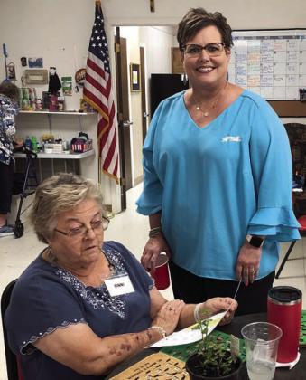 AT LE FT – Calling bingo recently at Senior Connections was Cheryl Brossmann (right) of Fayette Savings Bank, who is pictured with Ginni Berwick (left).