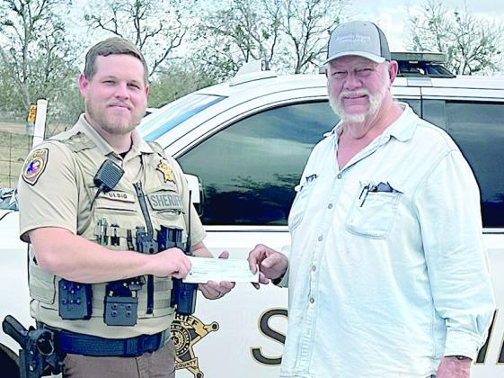 Hermann Sons Life gives to Deputy Santa