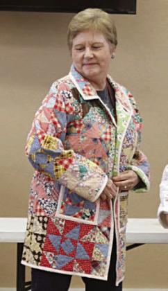 MODELING a jacket made from an old quilt is Marian Tajchman.