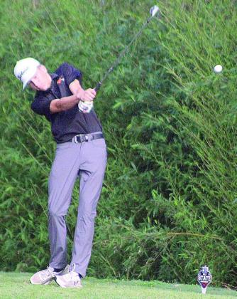 Van Prihoda sends his tee shot on the par-3 No. 15 hole onto the green in the first round. Sticker Photo By Darrell Vyvjala