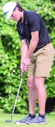 Jayse Janda putts for birdie on day one on the par-5 No. 14 hole. Sticker Photo By Darrell Vyvjala