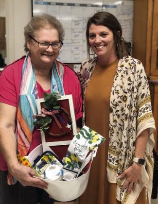 Bingo – Kathy Besetzny (left) made up for lost time and won many bingo games including the blackout prize. Also shown is Chyna Podhajsky (right), bingo caller from Hallettsville Nursing &amp;amp; Rehabilitation Center.