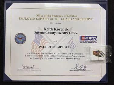 The award reads: “Office of the Secretary of Defense Employer Support of the Guard and Reserve recognizes Keith Korenek, Fayette County Sheriff's Office, as a Patriotic Employer for contributing to national security and protecting liberty and freedom by supporting employee participation in America's National Guard and Reserve force.” Signing the document were the executive director and national chair, Employer Support of the Guard and Reserve.