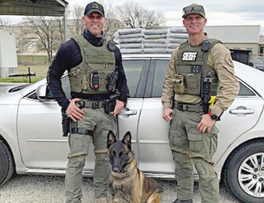 Sgt. Randy Thumann, his K-9 partner Kolt and Investigator David Smith with 15 bricks of cocaine valued at about $1,725,000 located in a Toyota Camry during a traffic stop on Interstate 10 near Flatonia.