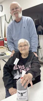 Bingo – Rusty Beckmann (back), member and board member, calls bingo games to finish out the day on Wednesdays. Cynthia Meyer (front), holds her blackout prize of two pounds of ground beef from Texas Beef Initiative.