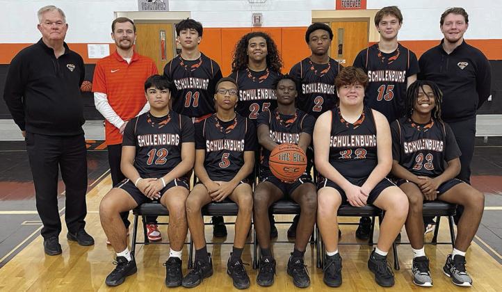Seated, from left: Trey Silcox, Jakaden Houston, Dekendrick King, Hayes Baumgarten, and M’Kai Wilson. Standing, from left: head coach Richard Hoogendoorn, assistant coach Jordan Hafley, Justin Curtis, Keigan Johnson, Devin Wilson, Parker Kahn, and assistant coach Aaron Rowlett. Sticker Photo By Darrell Vyvjala