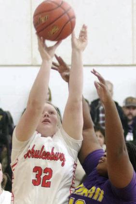 Ava Bubela scores under the basket in the second quarter last Tuesday. Sticker Photo By Darrell Vyvjala