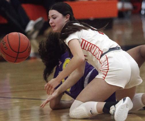 Ava Faith forces a Weimar turnover in the second quarter. Sticker Photo By Darrell Vyvjala