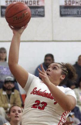 Arianna Vincent hits a shot in the lane in the first quarter against Weimar.