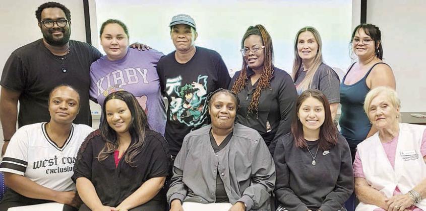 Completing the Blinn College medication aide course were (front row, from left) Courtney Young, Melanie Nutall, Demetrice Burns and Pricilla Corona; instructor Linda Rabel; (back row) Anthony Calvin, Adrianna Pineda, Serene Yancy, Ashley Wilson, Jessica Munsinger and Seleste Pineda.